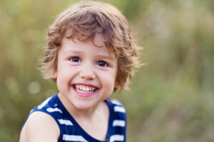 A happy kid smiling and laughing