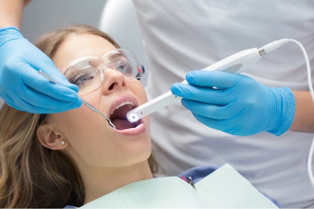 Male dentist in the dental cabinet