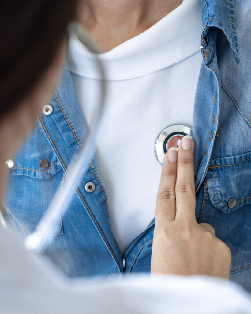 Close-up of doctor checking patient's vitals at a hospital