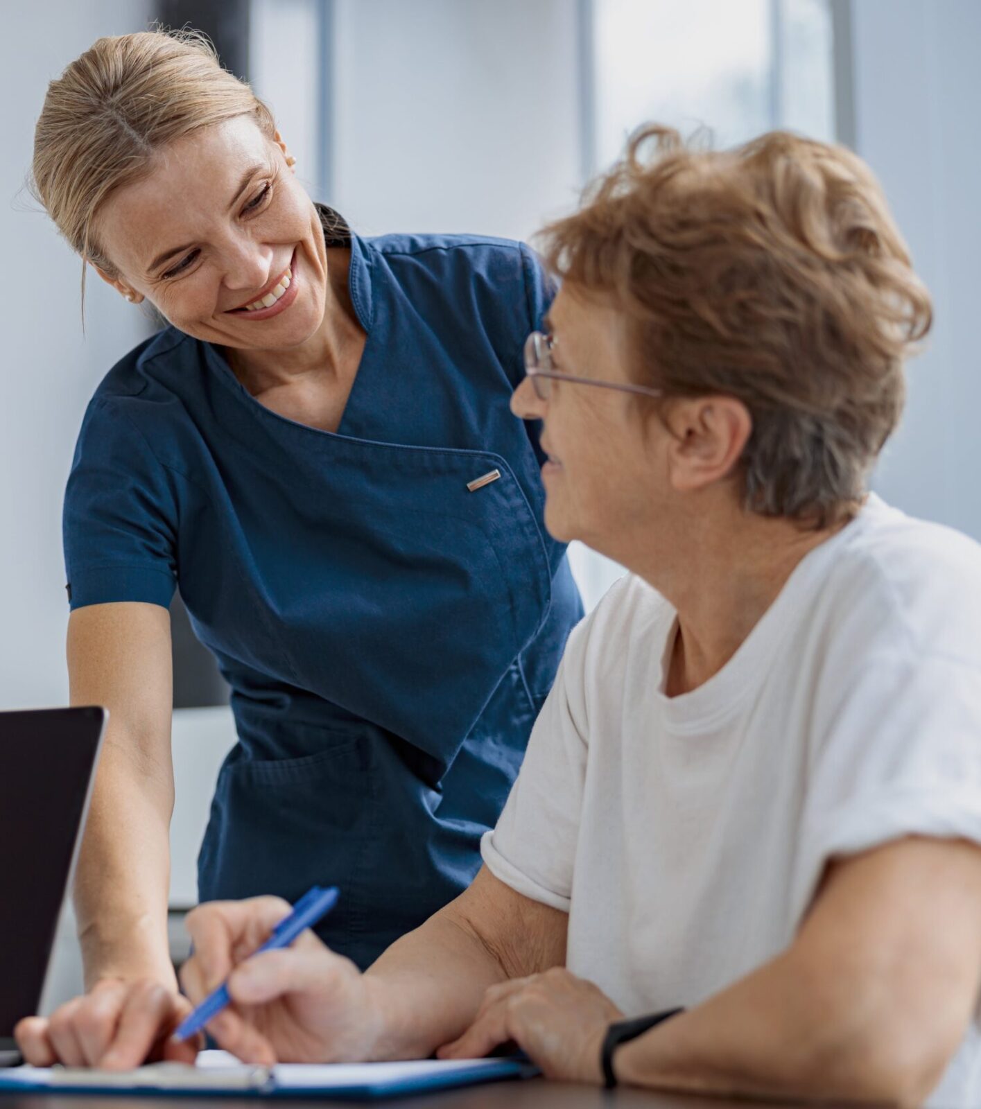 female patient filling insurance legal document