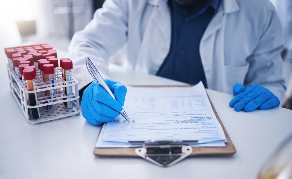 Blood test, science documents and hands in laboratory for healthcare results