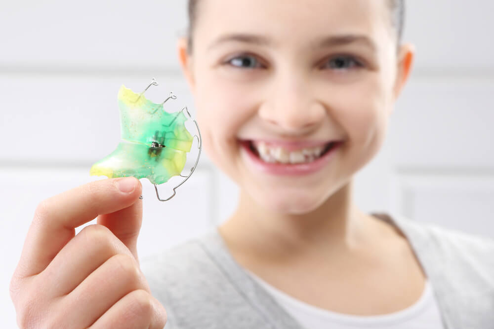 Portrait of a little girl with orthodontic appliance