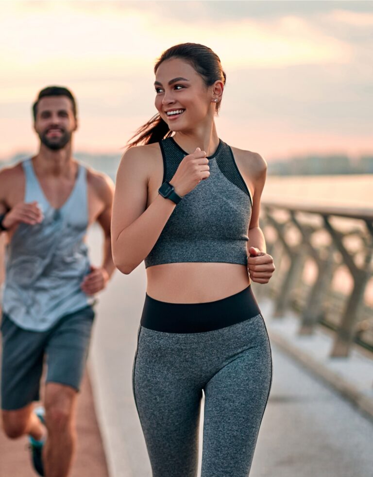 Couple doing sport together on the street. Morning run