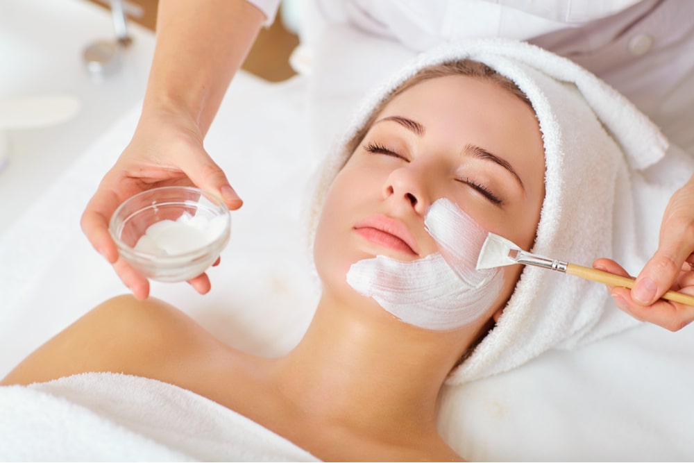 Woman in mask on face in spa beauty salon